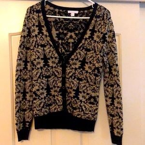 Good condition. Beautiful gold and black floral detail